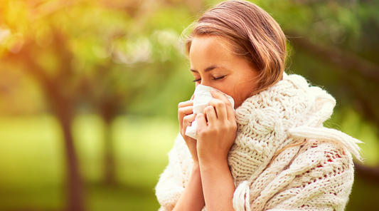Women sneezing due to allergy.