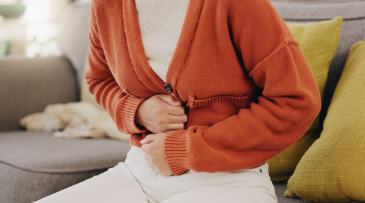 Cramps and Hands of Woman with Abdomen Pain