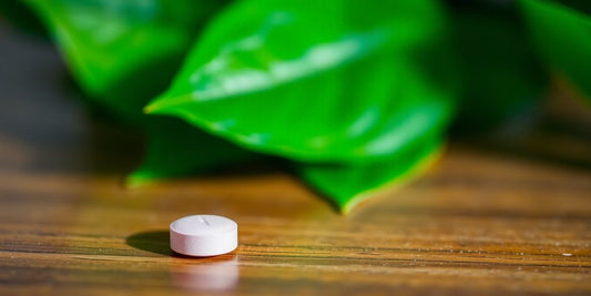 Fliban pill on the wooden surface