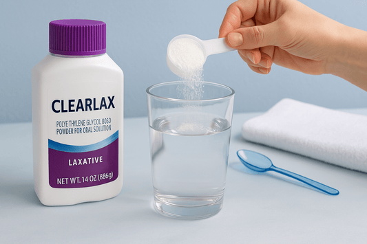 Clearlax powder being mixed into a glass of water for constipation relief