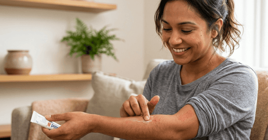 Woman applying Candid B cream on arm for fungal skin infection relief