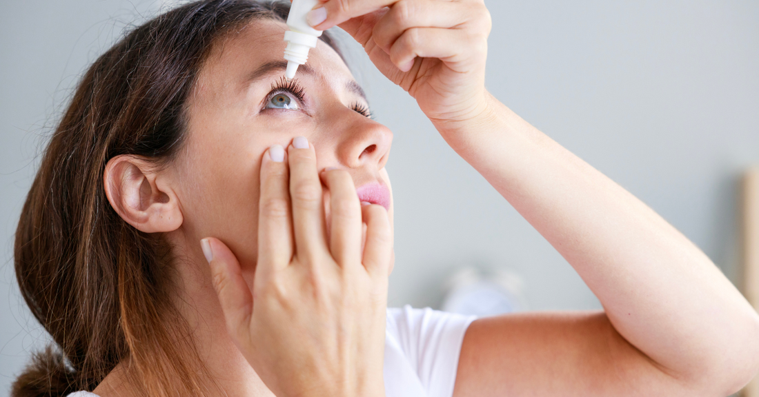 Woman putting Careprost eye drop in eye for better vision